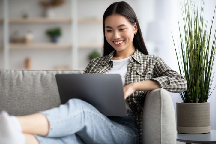 A recruiter working from home, laptop on their knees